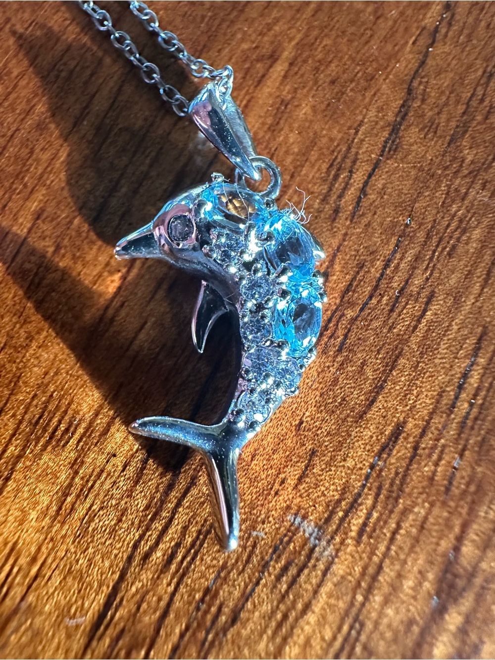 Silver Dolphin Pendant Necklace with Blue Crystal Accents